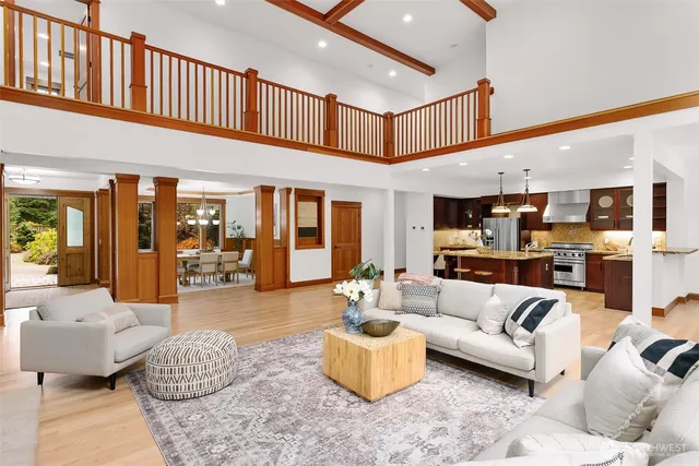 a living room with furniture and kitchen view