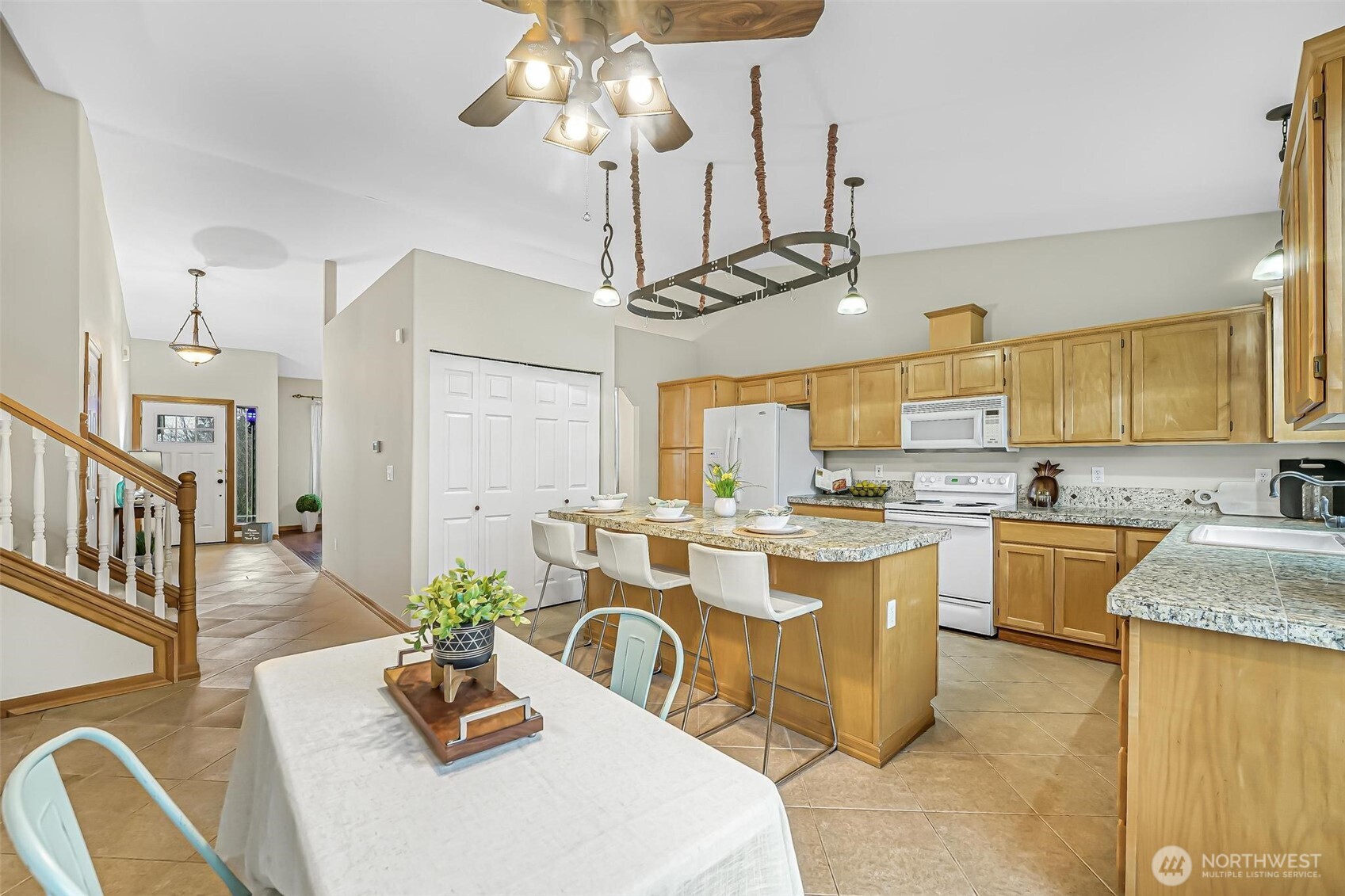 21012 Springhaven Way East Bonney Lake, WA 98391 - Photo 15 of 39 a large kitchen with a table and chairs