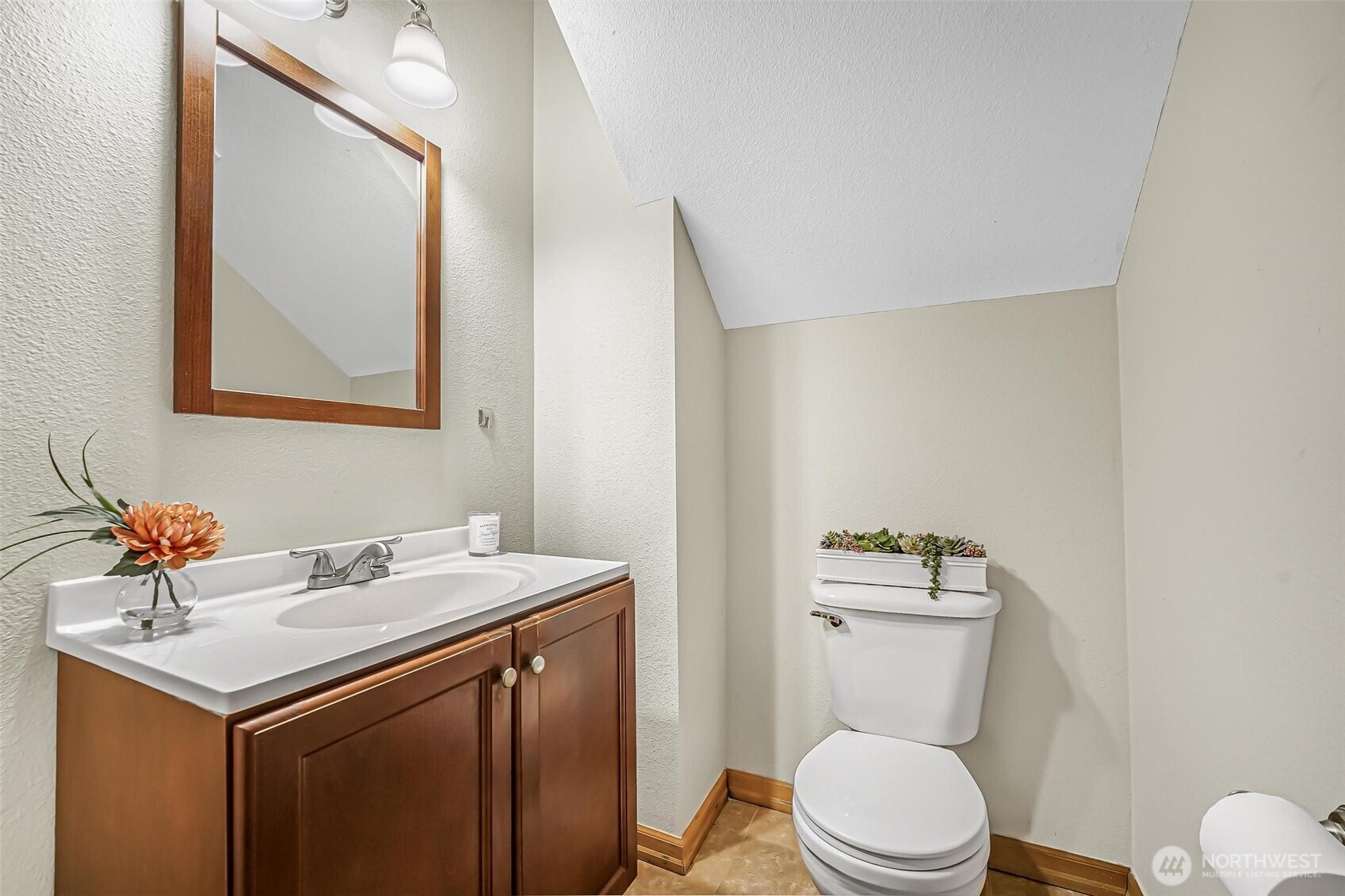 21012 Springhaven Way East Bonney Lake, WA 98391 - Photo 20 of 39 a bathroom with a toilet a sink and mirror