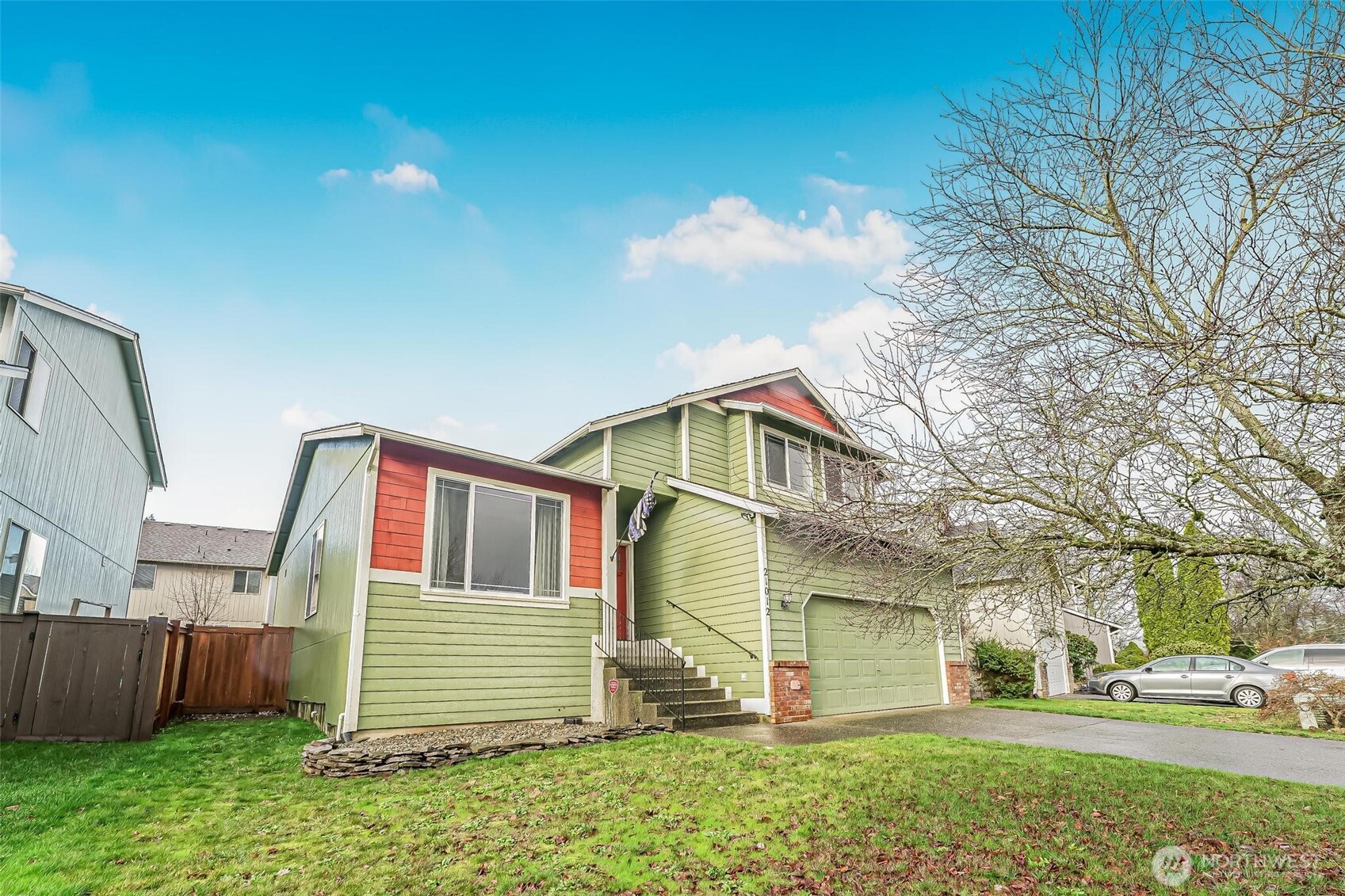 21012 Springhaven Way East Bonney Lake, WA 98391 - Photo 2 of 39 a front view of a house with a yard