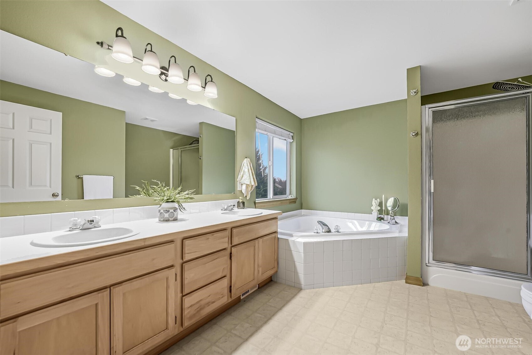 21012 Springhaven Way East Bonney Lake, WA 98391 - Photo 26 of 39 a bathroom with a sink double vanity mirror and a bathtub