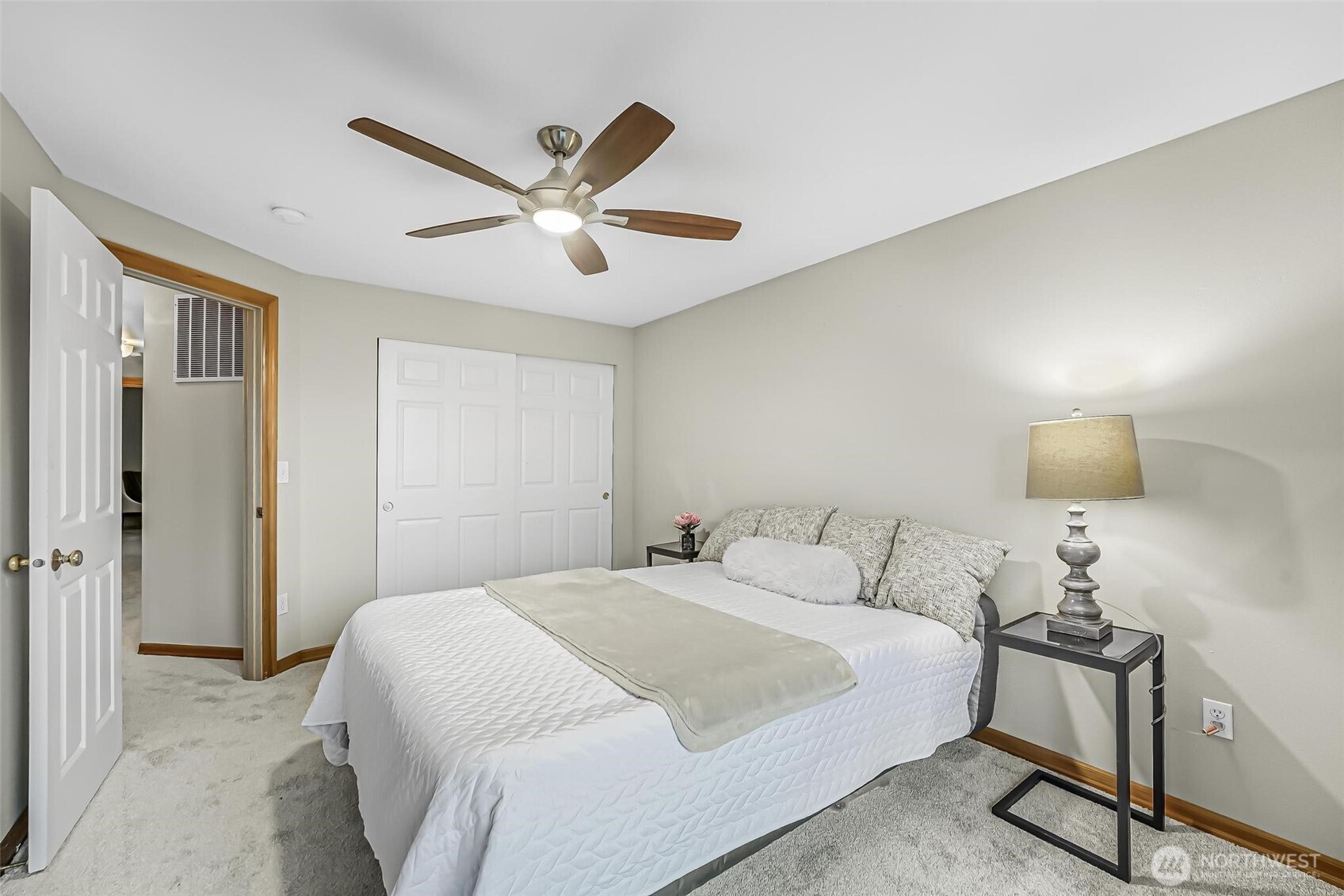21012 Springhaven Way East Bonney Lake, WA 98391 - Photo 29 of 39 a bedroom with a bed and a chandelier