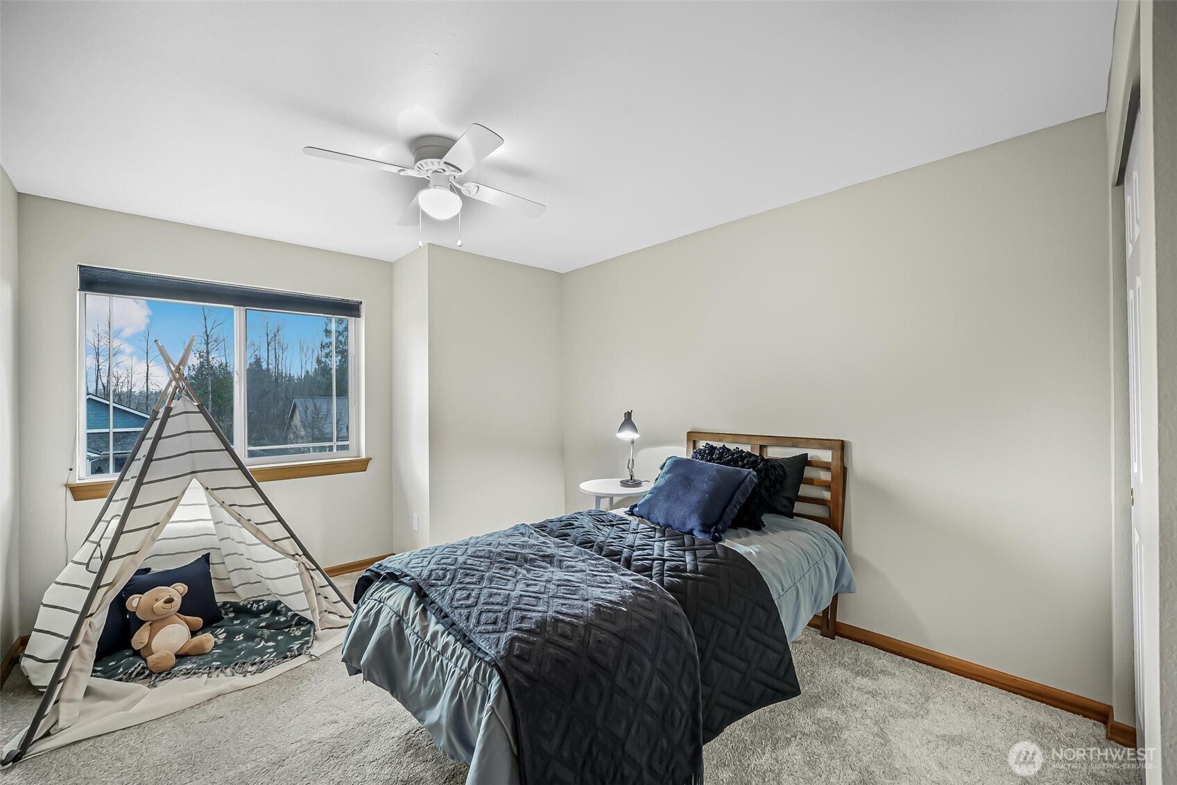 21012 Springhaven Way East Bonney Lake, WA 98391 - Photo 31 of 39 a bedroom with a bed and a window