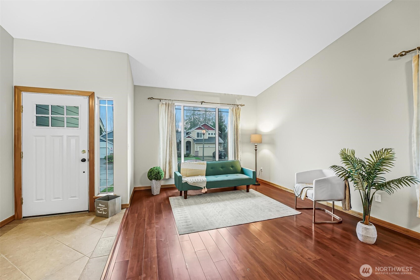 21012 Springhaven Way East Bonney Lake, WA 98391 - Photo 5 of 39 a living room with furniture and a potted plant
