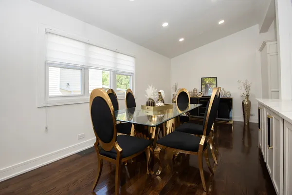 a view of a dining room with furniture and wooden floor