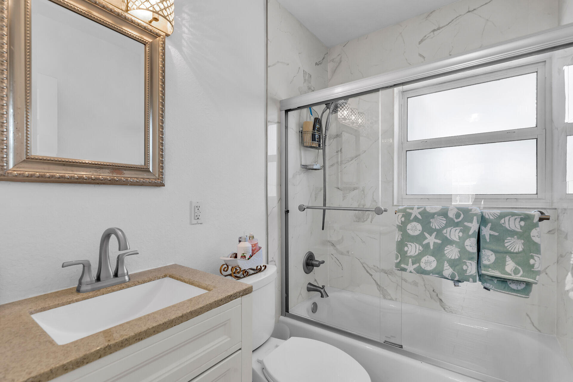 690 79th Street Marathon, FL 33050 - Photo 30 of 45 a bathroom with a sink a toilet and shower