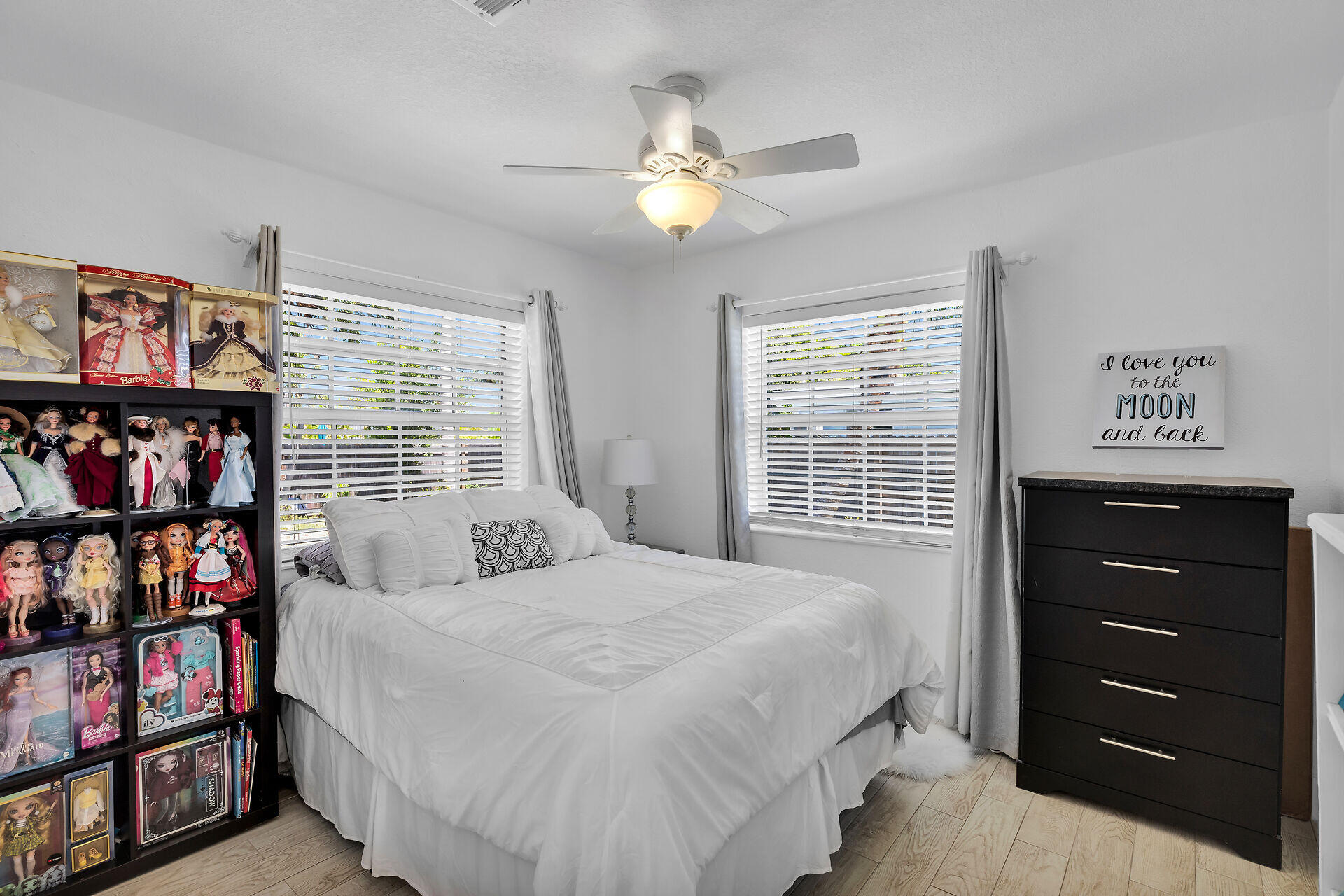 690 79th Street Marathon, FL 33050 - Photo 31 of 45 a bedroom with a bed a dresser and a book shelf