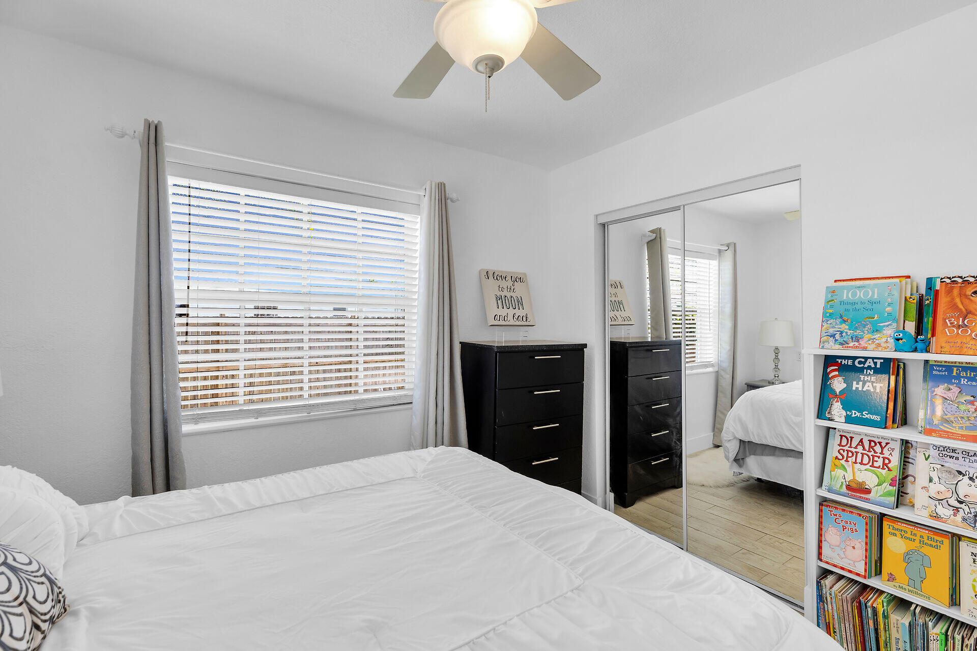 690 79th Street Marathon, FL 33050 - Photo 33 of 45 a bedroom with a bed and a book shelf