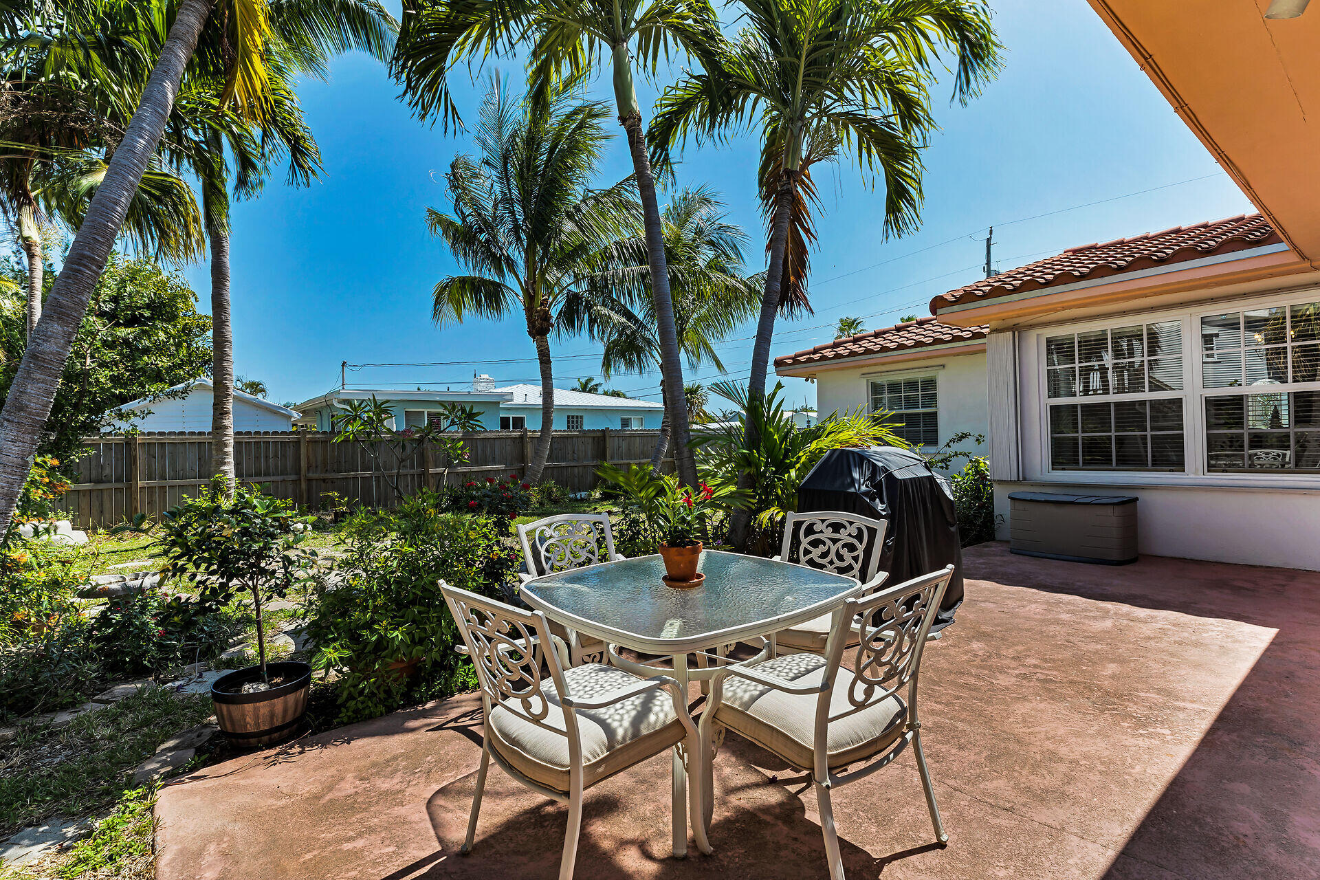 690 79th Street Marathon, FL 33050 - Photo 35 of 44 a view of a patio with table and chairs and potted plants