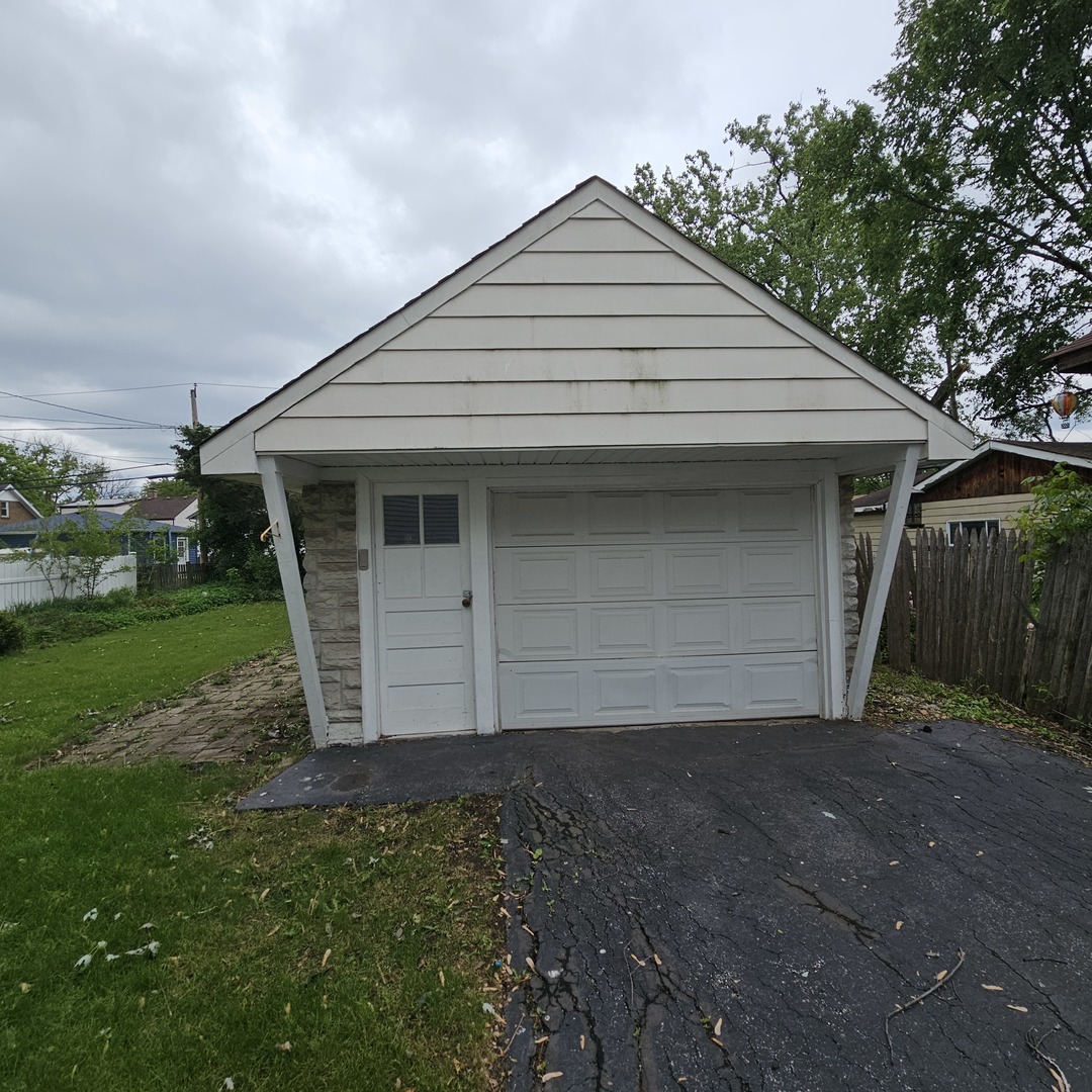 237 Pine Street Villa Park, IL 60181 - Photo 3 of 13 a front view of a house with a yard and garage