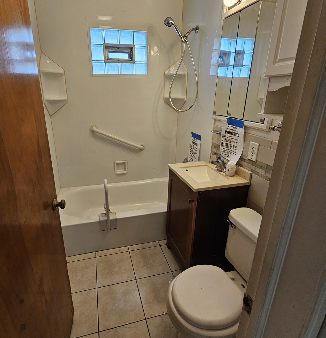 237 Pine Street Villa Park, IL 60181 - Photo 9 of 13 a bathroom with a toilet sink and shower