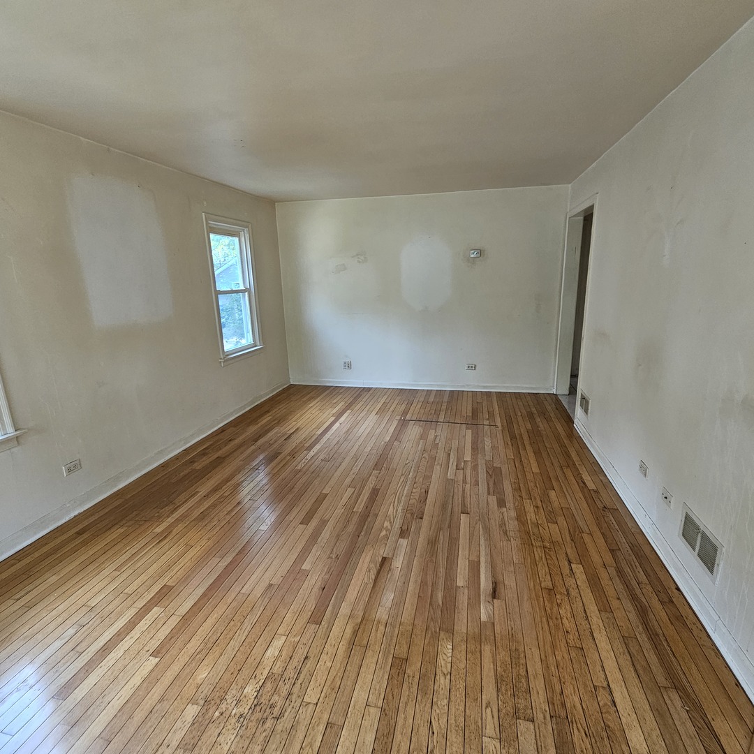 237 Pine Street Villa Park, IL 60181 - Photo 10 of 13 a view of a room with wooden floor and window