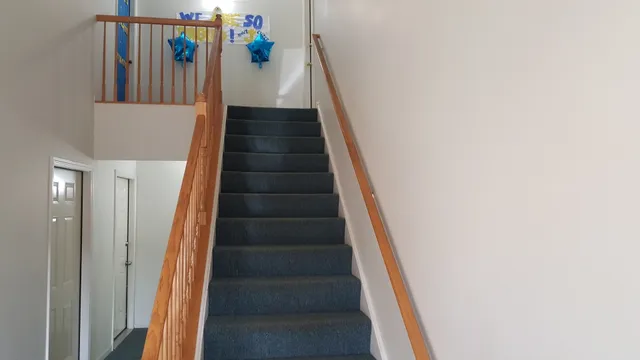 a kitchen with a sink a stove and a refrigerator