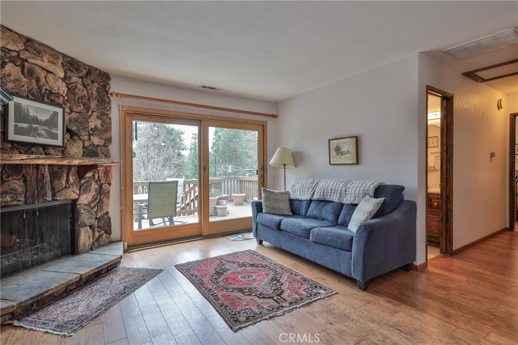 39177 Arapahoe Road Fawnskin, CA 92333 - Photo 11 of 39 a living room with furniture and a fireplace
