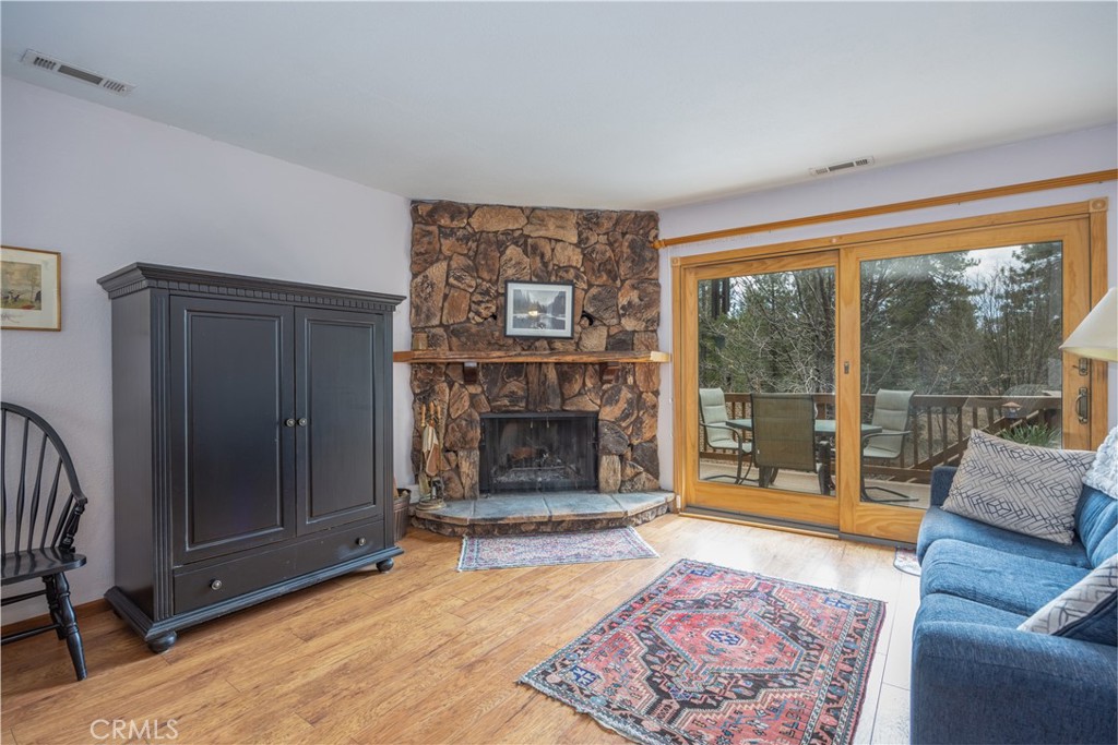 39177 Arapahoe Road Fawnskin, CA 92333 - Photo 12 of 39 a living room with furniture and a fireplace