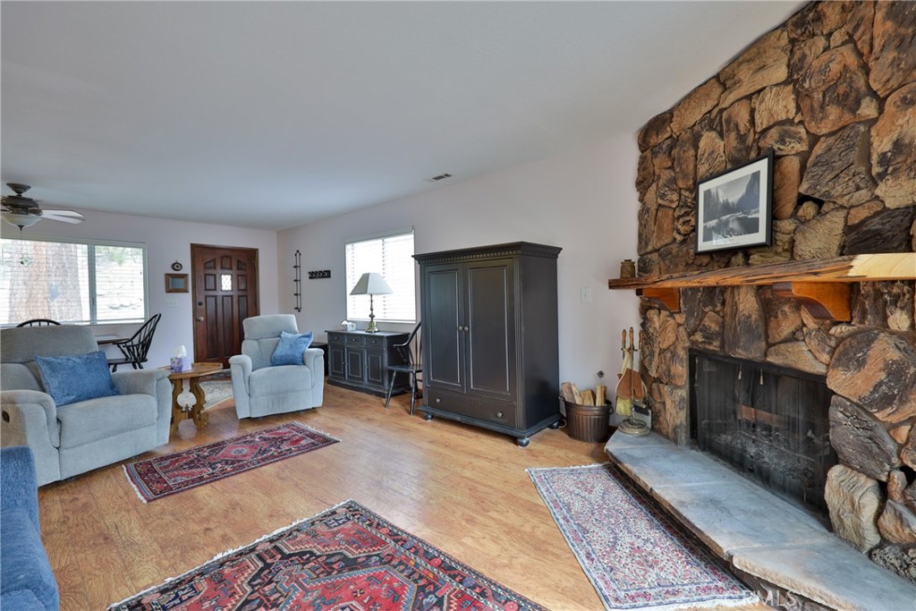 39177 Arapahoe Road Fawnskin, CA 92333 - Photo 15 of 39 a living room with furniture and a fireplace