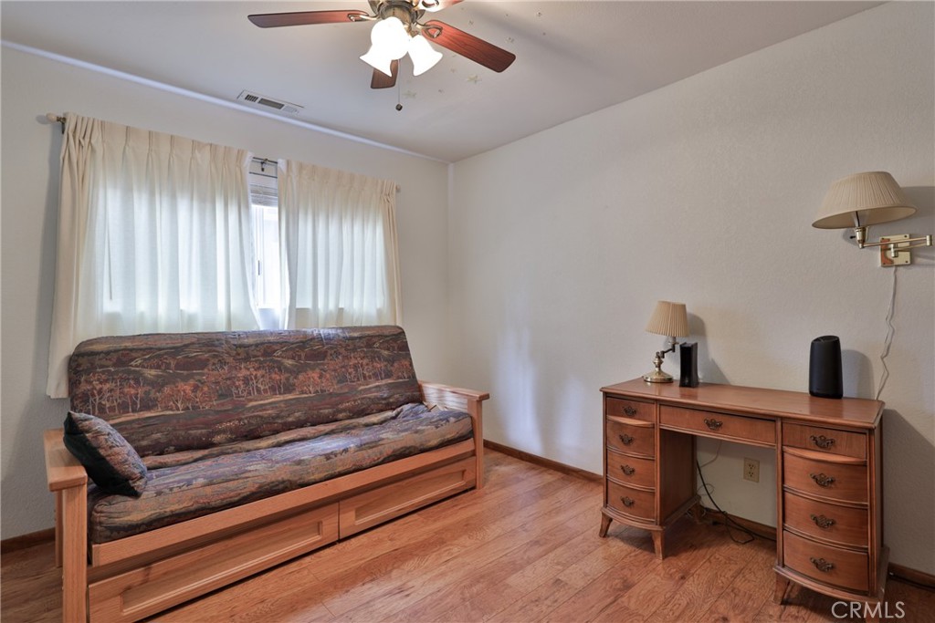 39177 Arapahoe Road Fawnskin, CA 92333 - Photo 22 of 39 a bedroom with a bed and a desk