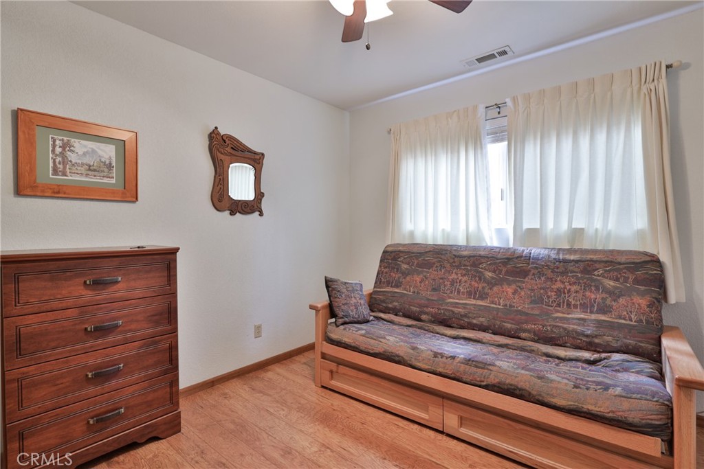 39177 Arapahoe Road Fawnskin, CA 92333 - Photo 23 of 39 a bedroom with a bed and a window