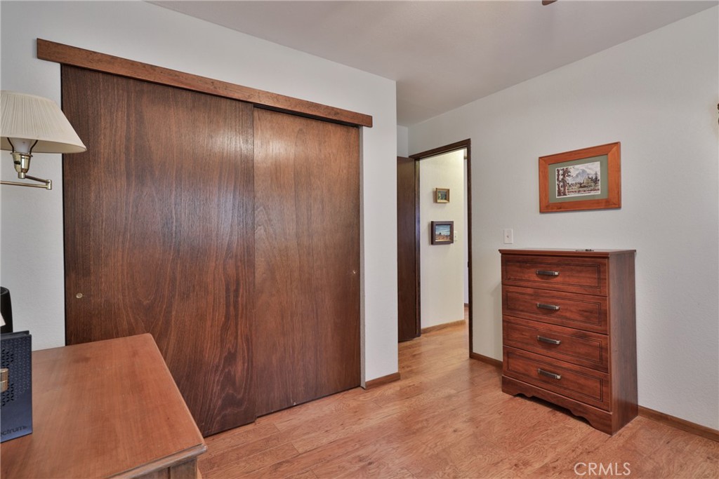 39177 Arapahoe Road Fawnskin, CA 92333 - Photo 24 of 39 an empty room with closet and dresser