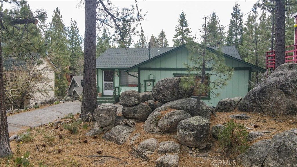 39177 Arapahoe Road Fawnskin, CA 92333 - Photo 6 of 39 a view of a house with a yard and large trees