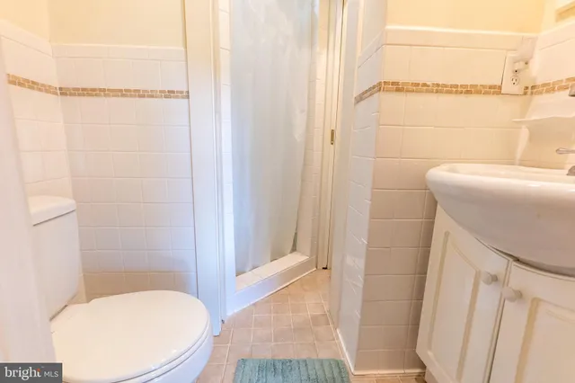 a bathroom with a toilet and shower