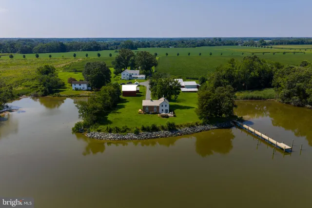 a view of a lake with a house in the background