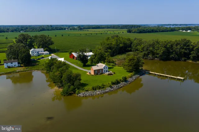a view of a lake with a house in the background