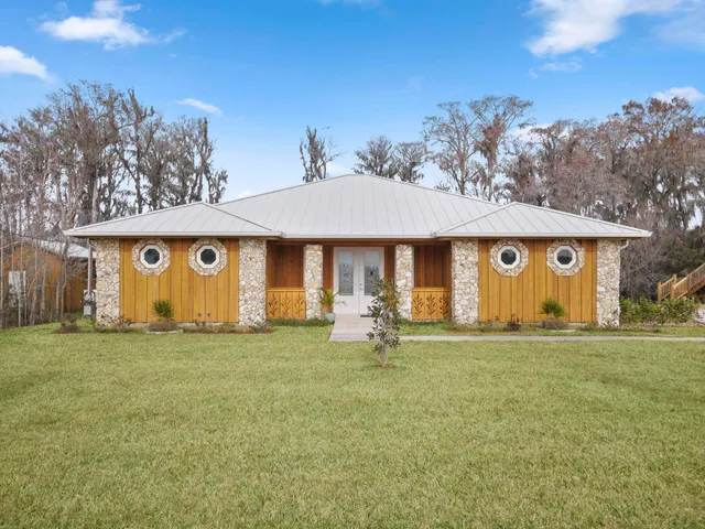 a front view of a house with garden