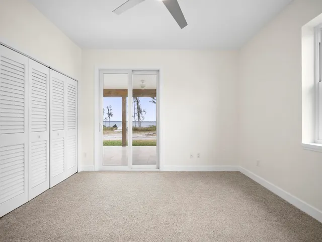 a bathroom with a granite countertop sink a mirror and shower