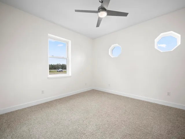 a view of dining room with furniture and chandelier