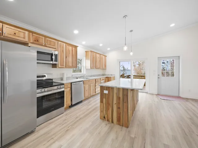 a bedroom with a couch and window