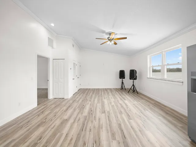 an outdoor space with patio and white umbrellas