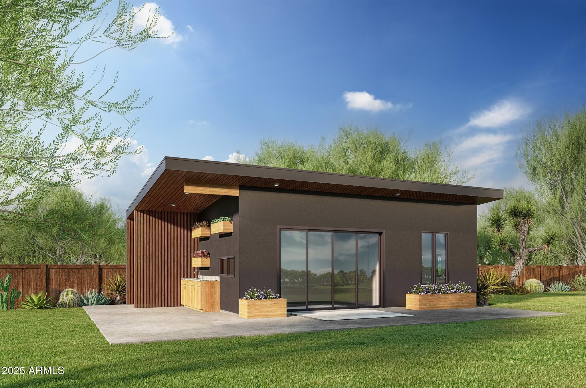 2002 East Whitton Avenue, Unit 32 Phoenix, AZ 85016 - Photo 3 of 6 a front view of a house with a yard