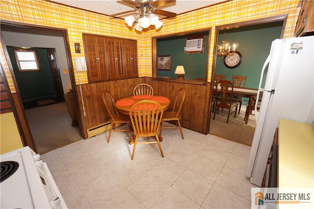 32 Predmore Avenue Colonia, NJ 07067 - Photo 12 of 28 a view of a dining room with furniture and a chandelier