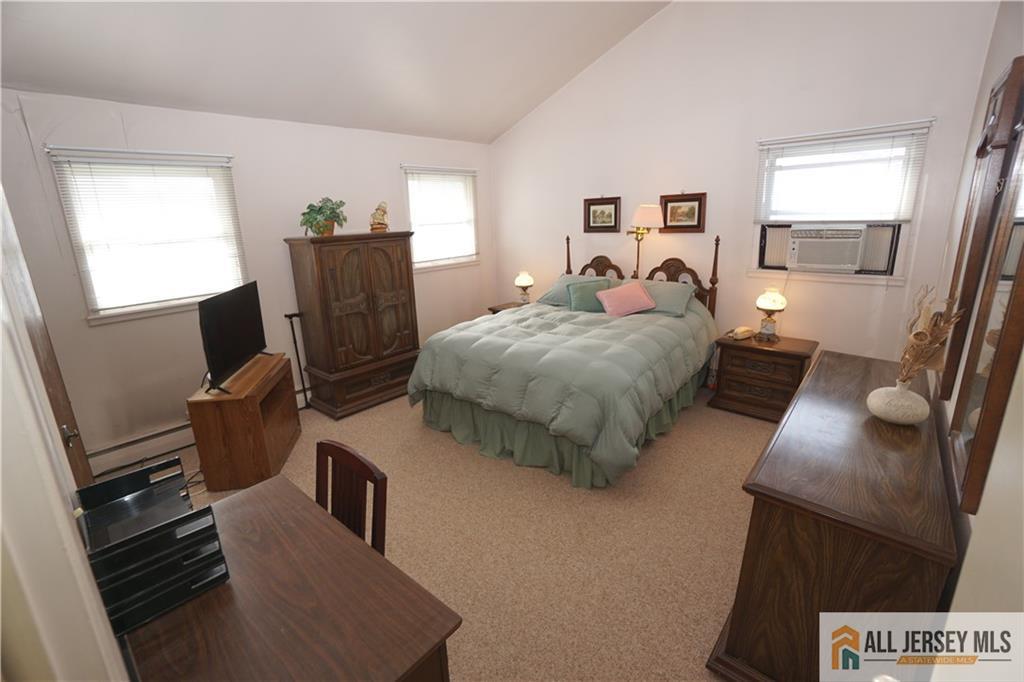 32 Predmore Avenue Colonia, NJ 07067 - Photo 13 of 28 a bed room with bed and window