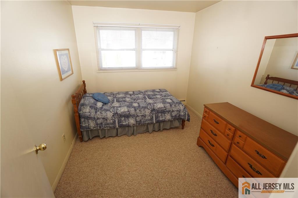 32 Predmore Avenue Colonia, NJ 07067 - Photo 15 of 28 a bed room with a bed and a window