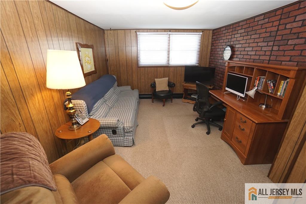 32 Predmore Avenue Colonia, NJ 07067 - Photo 19 of 28 a living room with furniture and a flat screen tv