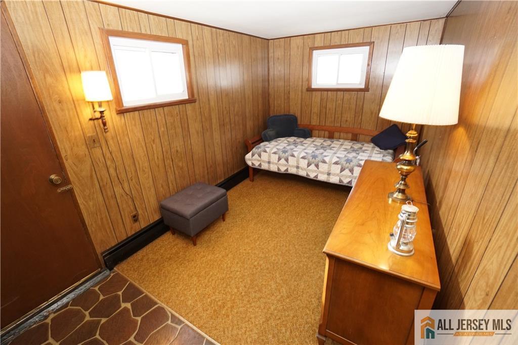 32 Predmore Avenue Colonia, NJ 07067 - Photo 21 of 28 a bedroom with a bed and a window