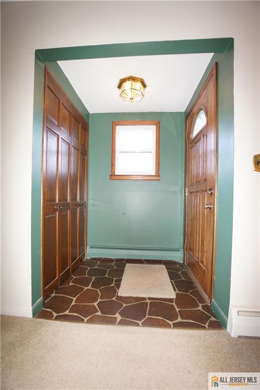 32 Predmore Avenue Colonia, NJ 07067 - Photo 22 of 28 a room with a door open to a room