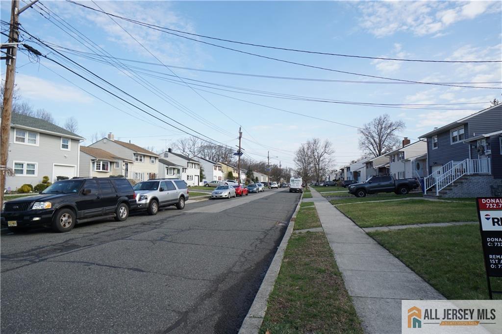 32 Predmore Avenue Colonia, NJ 07067 - Photo 28 of 28 a view of a street that has parked cars
