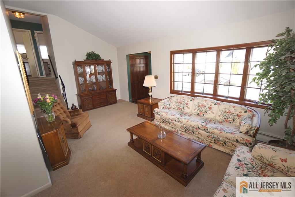 32 Predmore Avenue Colonia, NJ 07067 - Photo 6 of 28 a living room with furniture and a flat screen tv