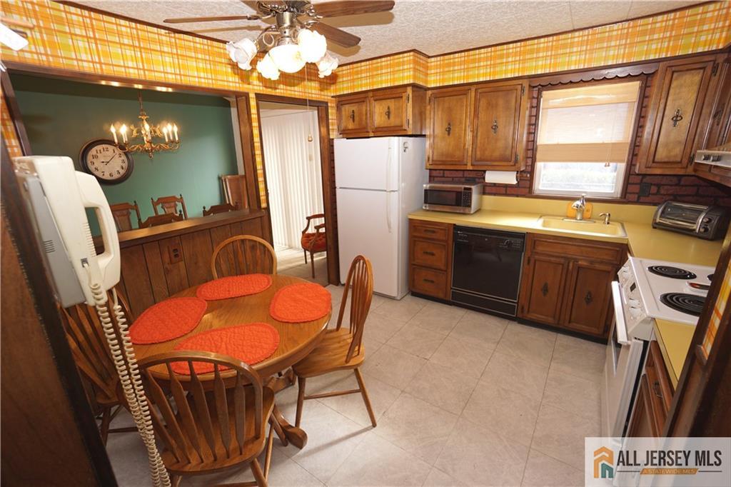 32 Predmore Avenue Colonia, NJ 07067 - Photo 10 of 28 a view of a dining room with furniture window and wooden floor