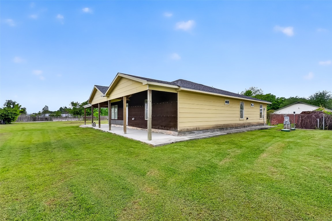 6014 Linda Drive Rosharon, TX 77583 - Photo 2 of 23 Neat horizontal siding and a wrap-around concrete walkway lead toward the rear of the residence.