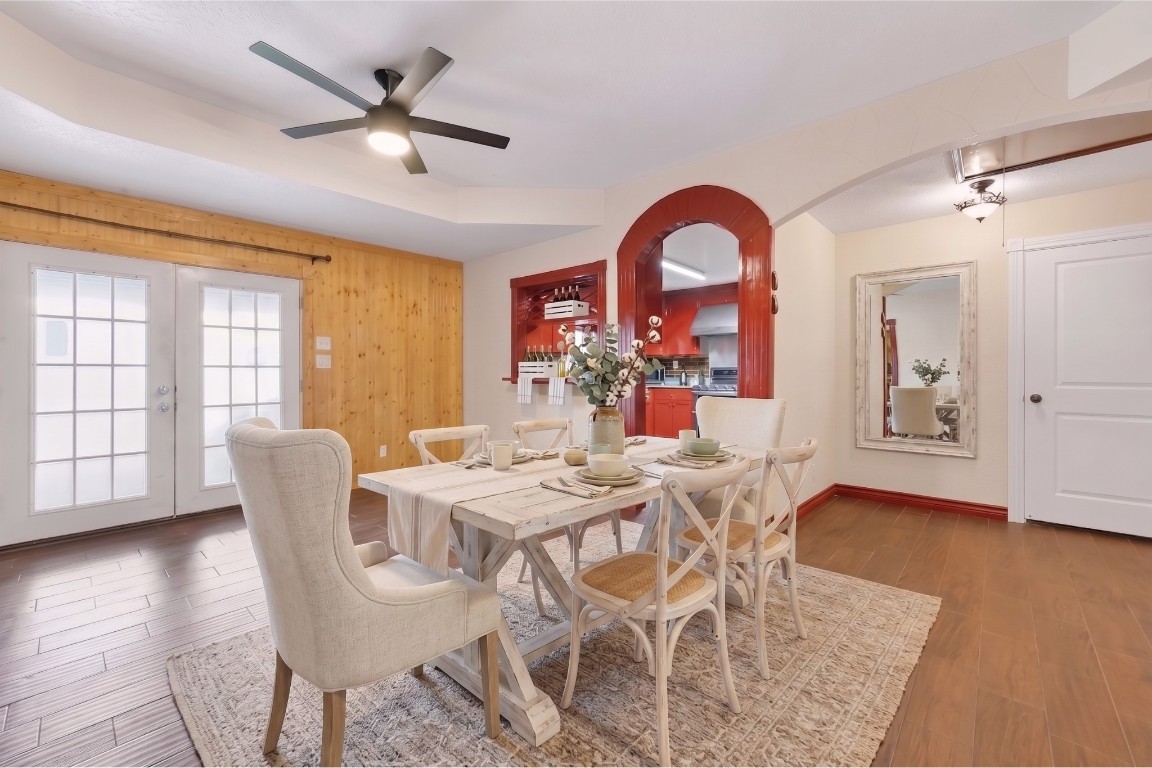 6014 Linda Drive Rosharon, TX 77583 - Photo 7 of 23 A bright breakfast nook offers direct access to the outdoors through classic French doors, situated just off the kitchen’s distinctive arched entryway.
