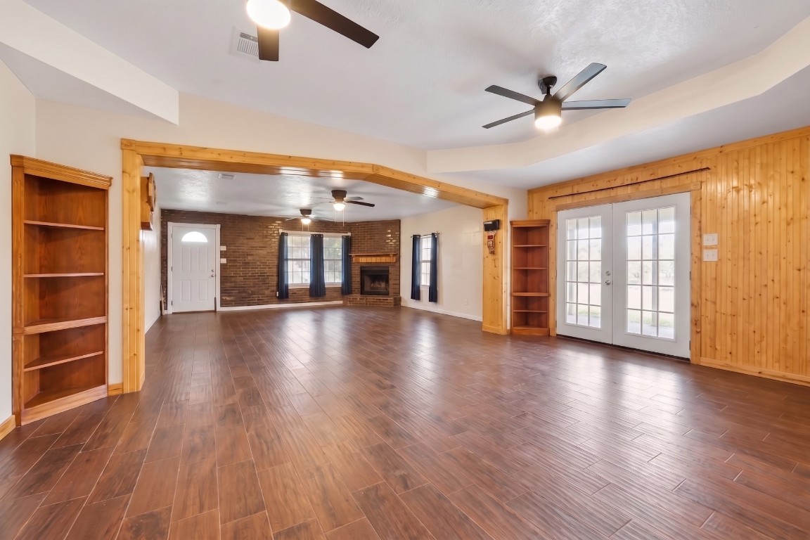 6014 Linda Drive Rosharon, TX 77583 - Photo 23 of 23 Large architectural cutouts and tall ceilings create an airy, interconnected feel throughout the central floor plan.