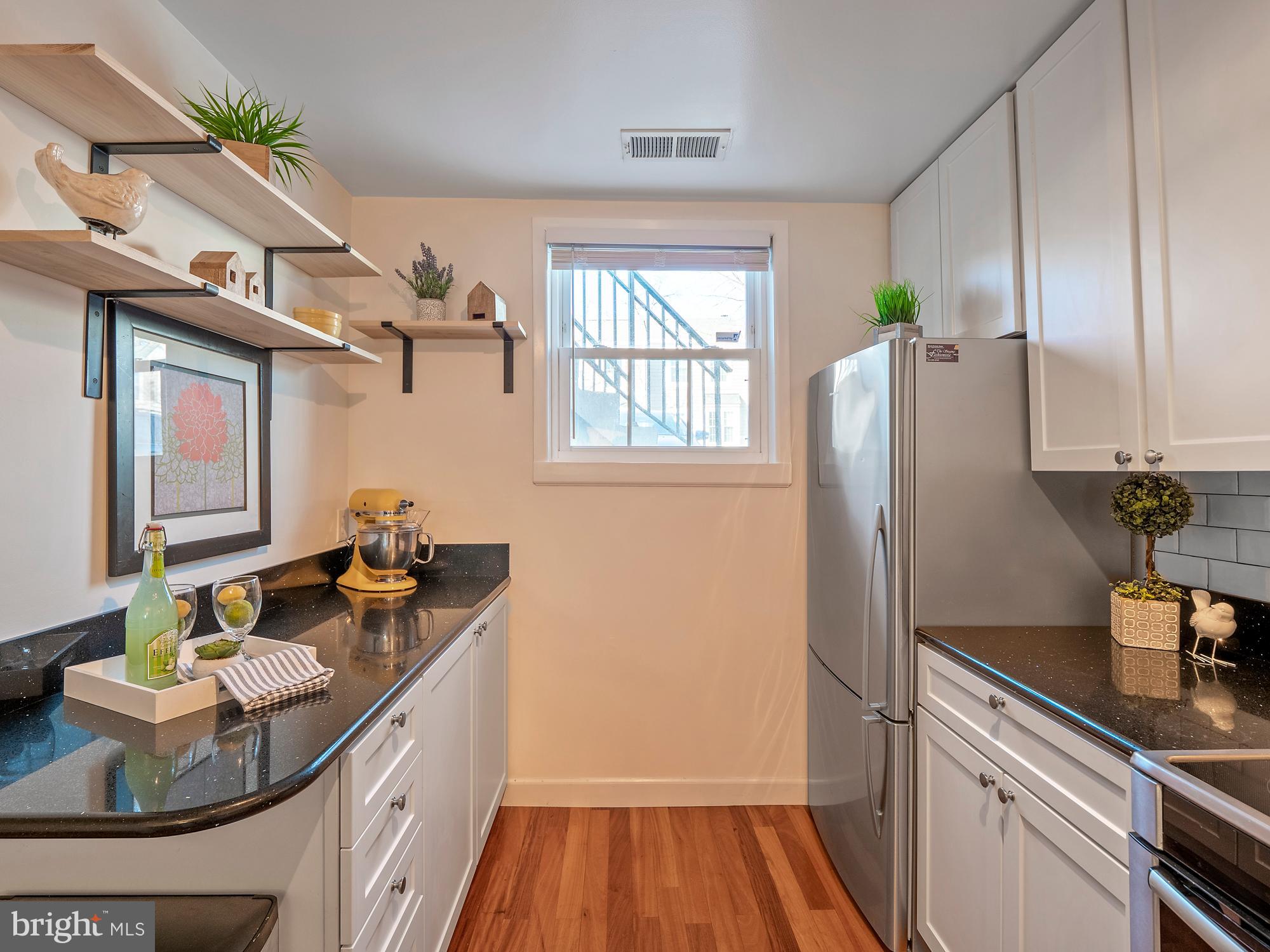 3902 9th Road South Arlington, VA 22204 - Photo 9 of 45 Kitchen with Natural Light & Storage Options