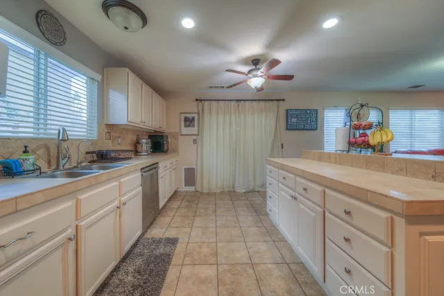 a view of a hallway with wooden floor and windows