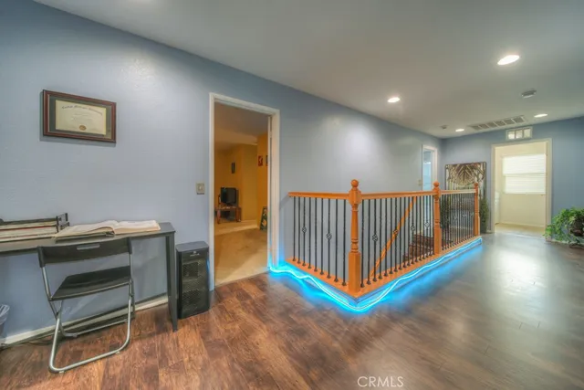 a bedroom with a bed and a chair