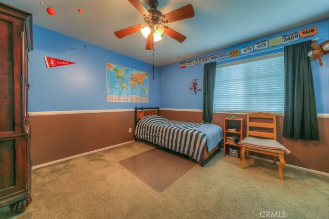 a bed room with a bed and a chandelier