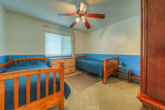 a bedroom with a bed and dresser